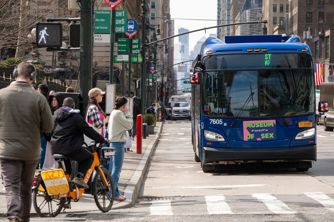 Image of a NYC bus with a Museum of Sex ad on the front